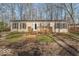 Inviting single-story home with a charming front porch and well-maintained landscaping at 10614 W Hickory Ct, Quincy, IN 47456