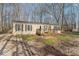 Charming one-story home with a cozy front porch and established trees around the house at 10614 W Hickory Ct, Quincy, IN 47456