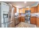Modern kitchen featuring stainless steel appliances, shaker cabinets, and a mosaic backsplash at 10614 W Hickory Ct, Quincy, IN 47456