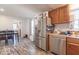 Bright eat-in kitchen with stainless steel appliances, wood cabinets, and lots of natural light at 10614 W Hickory Ct, Quincy, IN 47456