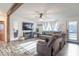 Inviting living room with a large TV, cozy sofas, and abundant natural light at 10614 W Hickory Ct, Quincy, IN 47456