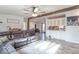 Spacious living room featuring hardwood floors, a comfortable sofa, and an open layout at 10614 W Hickory Ct, Quincy, IN 47456