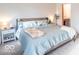 Main bedroom features a bed, carpet and natural light at 10614 W Hickory Ct, Quincy, IN 47456