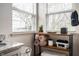 Well-organized bathroom with open shelving, providing storage for towels and toiletries near bright windows at 10799 Belair Dr, Carmel, IN 46280