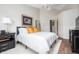 Well-lit bedroom with a comfortable bed, side tables, and ample natural light at 10799 Belair Dr, Carmel, IN 46280