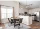 A cozy dining room features a table for four, creating an inviting space for Gathering meals at 10799 Belair Dr, Carmel, IN 46280