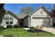 Charming single-Gathering home boasts a two-car garage and well-maintained landscaping at 10799 Belair Dr, Carmel, IN 46280