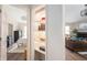 Bright and airy living room offering open shelving and seamlessly connects to the bedroom at 10799 Belair Dr, Carmel, IN 46280
