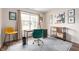 Stylish home office with modern decor, featuring a sleek desk, comfortable chair, and ample lighting at 10799 Belair Dr, Carmel, IN 46280