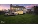 Back exterior of home featuring a large backyard, screen porch and play set at 10889 Weston Dr, Carmel, IN 46032