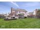 Large backyard with a screened porch, mature trees, and play set area at 10889 Weston Dr, Carmel, IN 46032