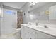 Bright bathroom featuring a double vanity, and a shower/tub combo with gray walls at 10889 Weston Dr, Carmel, IN 46032