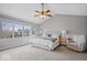 Bright bedroom with a ceiling fan, neutral walls, and large windows at 10889 Weston Dr, Carmel, IN 46032