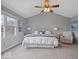 Bright bedroom with a ceiling fan, neutral walls, and large windows at 10889 Weston Dr, Carmel, IN 46032