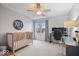 Neutral bedroom setup with a crib and workstation at 10889 Weston Dr, Carmel, IN 46032