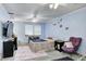 Calming bedroom with soft blue walls, ceiling fan, and neutral toned furnishings at 11416 Stoeppelwerth Dr, Indianapolis, IN 46229
