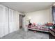 Neutral bedroom featuring a bed, closet, and natural light, perfect for relaxation and personalization at 11416 Stoeppelwerth Dr, Indianapolis, IN 46229