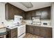 Functional kitchen equipped with essential appliances, ample counter space, and dark cabinetry at 11416 Stoeppelwerth Dr, Indianapolis, IN 46229