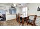 Dining Area features a dark wood table with seating for four and faux-brick accent wall at 11416 Stoeppelwerth Dr, Indianapolis, IN 46229