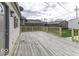 Spacious back deck with wood flooring and railing, perfect for outdoor entertaining and relaxation at 126 S 3Rd Ave, Beech Grove, IN 46107
