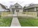View of the backyard featuring a wooden walkway, new back deck, and exterior door at 126 S 3Rd Ave, Beech Grove, IN 46107