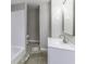 Bathroom showcasing a vanity with updated sink and faucet, and a shower/tub combination at 126 S 3Rd Ave, Beech Grove, IN 46107