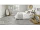 Bright bedroom with neutral decor, including a single bed, side table, and decorative artwork at 126 S 3Rd Ave, Beech Grove, IN 46107