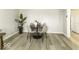 Dining area featuring a sleek table with seating for four, complemented by stylish decor and natural light at 126 S 3Rd Ave, Beech Grove, IN 46107