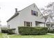 Charming two-story home with vinyl siding and a well-maintained front yard with manicured hedges at 126 S 3Rd Ave, Beech Grove, IN 46107