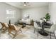 Well-lit living room offering a comfortable seating arrangement and decor for relaxing and entertaining at 126 S 3Rd Ave, Beech Grove, IN 46107