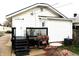Cozy backyard featuring a deck, patio area with seating, and a grill, perfect for outdoor entertaining at 1311 N Denny St, Indianapolis, IN 46201