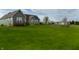 Sprawling backyard featuring lush lawn and additional structure with horse paddock at 13151 Walters Rd, Martinsville, IN 46151