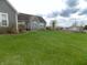 Backyard view highlighting the well maintained lawn, and partial view of the house at 13151 Walters Rd, Martinsville, IN 46151