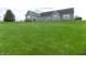 Expansive backyard view featuring lush green lawn and partial view of home's rear exterior at 13151 Walters Rd, Martinsville, IN 46151