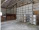 This barn features a large garage door, concrete floor and a horse stall at 13151 Walters Rd, Martinsville, IN 46151