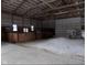 Spacious barn interior with high ceilings, stalls, and ample room for storage or activities at 13151 Walters Rd, Martinsville, IN 46151