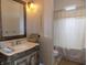 Bathroom featuring ornate vanity and framed mirror, plus neutral-toned shower at 13151 Walters Rd, Martinsville, IN 46151