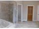 Bathroom with a large shower, tub and tile flooring at 13151 Walters Rd, Martinsville, IN 46151