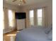 Bright main bedroom with hardwood floors, a ceiling fan and large windows at 13151 Walters Rd, Martinsville, IN 46151