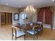 Formal dining room with chandelier, hardwood flooring, and elegant window treatments at 13151 Walters Rd, Martinsville, IN 46151