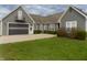 Charming home featuring a spacious driveway, two-car garage, and lush green lawn at 13151 Walters Rd, Martinsville, IN 46151