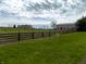 Picturesque acreage with green pastures, wood fencing, a barn, and a glimpse of the main house at 13151 Walters Rd, Martinsville, IN 46151