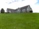 Beautiful home featuring a sprawling lawn and a seamless blend with nature on a hilltop at 13151 Walters Rd, Martinsville, IN 46151