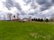 Scenic horse property showing lush green pastures and a barn with expansive fenced acreage at 13151 Walters Rd, Martinsville, IN 46151