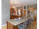 Open kitchen featuring an island with bar seating and stainless sink at 13151 Walters Rd, Martinsville, IN 46151