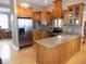 Spacious kitchen featuring stainless steel appliances, granite countertops, and wood cabinetry at 13151 Walters Rd, Martinsville, IN 46151