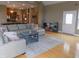 Spacious living room with a comfortable sectional, neutral decor, and hardwood floors throughout at 13151 Walters Rd, Martinsville, IN 46151