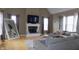 Cozy living room with a fireplace, large windows, and a comfortable sectional sofa at 13151 Walters Rd, Martinsville, IN 46151