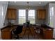 Bright office space with custom built-ins and large windows overlooking the yard at 13151 Walters Rd, Martinsville, IN 46151