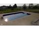 A serene in-ground pool with a smooth concrete surround with a rural view at 13151 Walters Rd, Martinsville, IN 46151